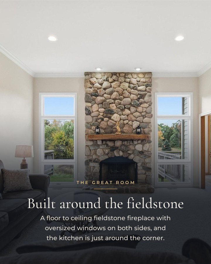 Slide 3: The great room and its fieldstone fireplace